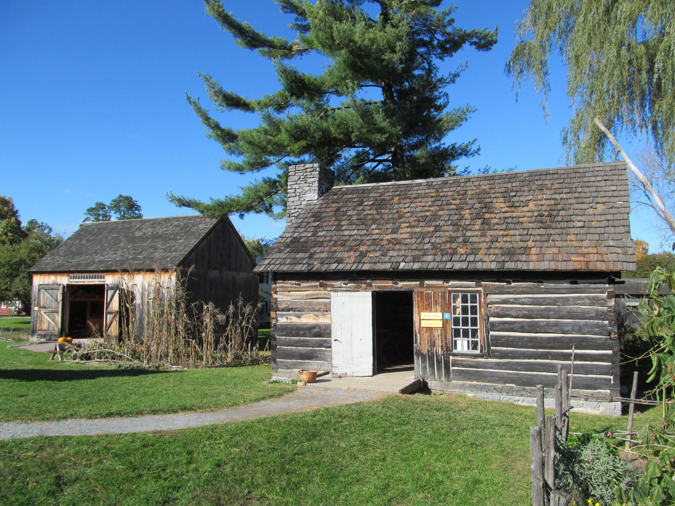 Early American wooden settler cabin in rural southern landscape similar to early Newton Alabama homes